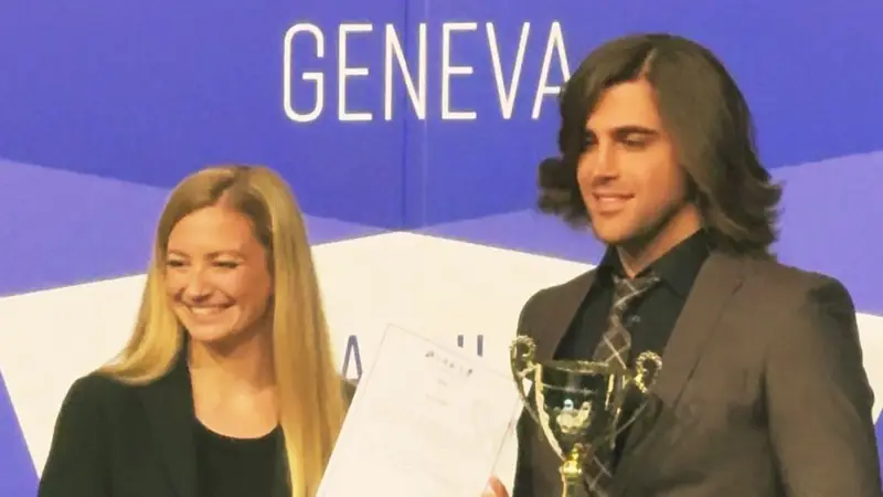 hamzeh najafimehr receiving bronze medal and jury trophy for ai-powered vr glasses at geneva invention fair 2024